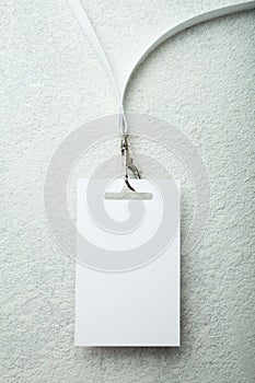 Blank badge with white neckband on white background photo