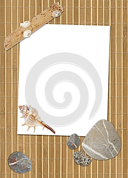 Blank on bamboo with sea stones and cockleshell
