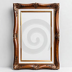 Blank beautiful wooden photo frame isolated on white background near white wall, empty copy space,