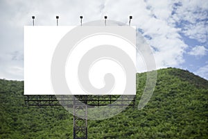 Blank big billboard against green mountain and blue sky background,for your advertising,put your own text here