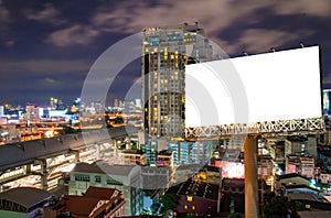 Blank billboard for advertisement in city downtown at night