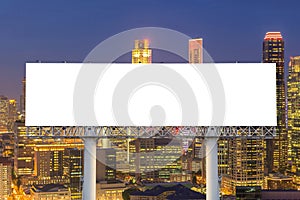 Blank billboard for advertisement in city downtown at night