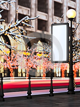 Blank billboard at christmas illuminated street.