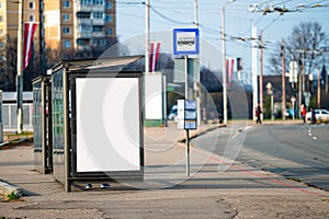 Blank billboard with copy space ready for design at bus stop, outdoor advertising concept, mock up