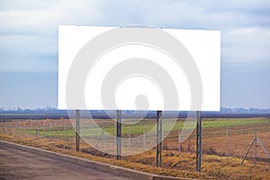 Blank billboard hoarding by the roadway