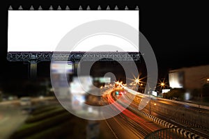 Blank billboard and light on highway road in night time.