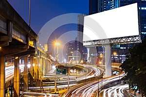 Blank billboard near expressway at night for advertisement