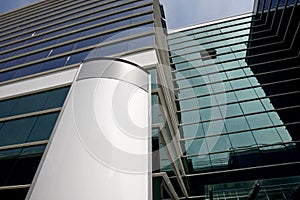 Blank billboard on office building facade photo