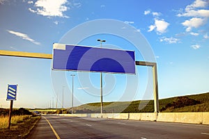 Blank billboard over an empty national highway