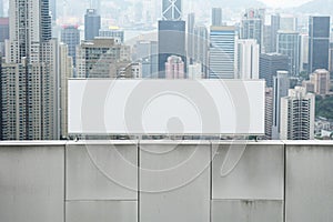 Blank billboard overlooking a cityscape panorama