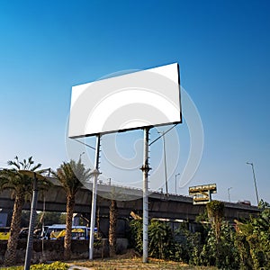 Blank billboard at roadside good viewership against clear sky