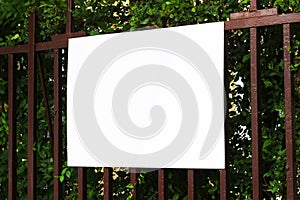 Blank billboard sign mockup on a fence in the urban environment, empty space to display advertising campaign mock up template