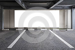 Blank billboard on the wall of the basement car park