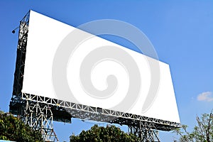 Blank billboard with white screen against clouds and blue sky background. Copy space banner for advertisement.