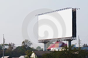 blank billboards in city with blue sky