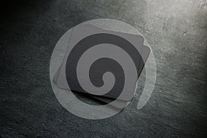 Blank black beer coaster stack mock up, top view