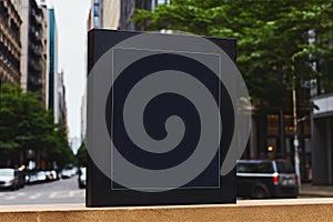 Blank black billboard on city street. Mock up, 3D Rendering, Black square signboard mockup outside of a building, AI Generated