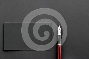 Blank black business card for mockup and pen as office flatlay background, luxury branding and corporate identity design
