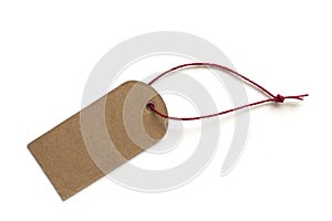 Blank black cardboard price tag or label tag with red thread isolated white background