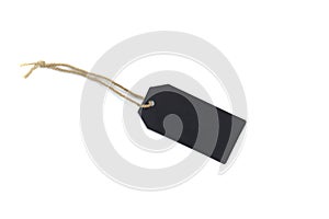 Blank black cardboard price tag or label tag with thread isolated on white background