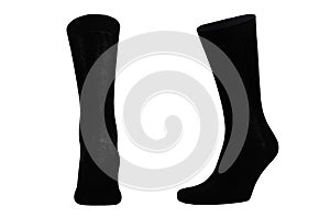 Blank black cotton long socks on invisible foot isolated on white background as mock up for advertising, branding, design.