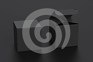 Blank black cube gift box with open and closed hinged flap lid on black background.