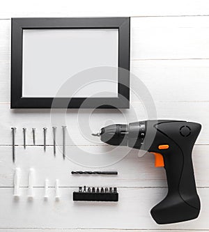 Blank Black frame with blank copy space. Driller with photo frame equipments.