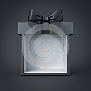 Blank black gift box product display with black ribbon bow isolated on dark background