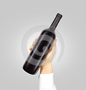 Blank black label mockup on bottle of red wine
