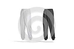 Blank black and melange sport sweatpants mockup, half-turned view