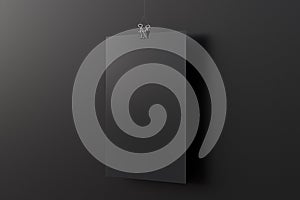 Blank black paper poster hanging on binder clip