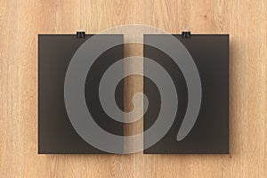 Blank black paper poster hanging on binder clip