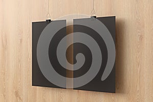 Blank black paper poster hanging on binder clip