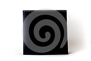 Blank black paper spiral calendar