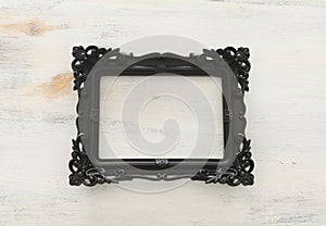 Blank black photo frame over white background. Ready for photography montage. top view flat lay