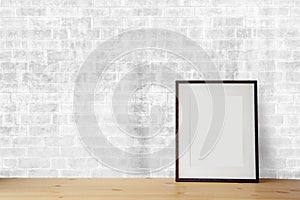 Blank black picture frame on the white brick wall and the wooden floor, template poster interior photo 3d background