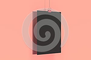Blank black poster with binder clip mockup on red background