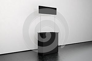 Blank black promo counter mockup stand near the wall, side view