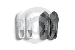 Blank black and white soccer boots pair mockup, top view