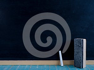 Blank blackboard chalks and eraser.