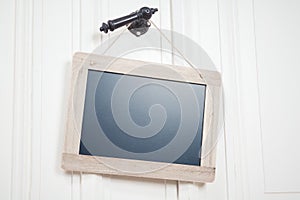 Blank Blackboard With Copy Space On A String Hanging On A Doorhandle photo