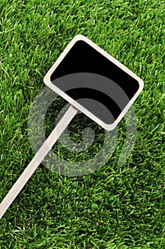 Blank blackboard label on the grass