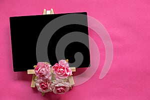 blank blackboard and pink flower on pink background with copy space, Valentines Day concept