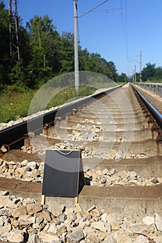 blank blackboard on the railroad