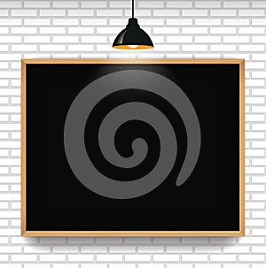 Blank blackboard in white brick wall background with hanging light