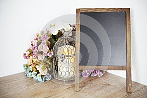 Blank Blackboard wooden easel with flower and LED candle light decoration