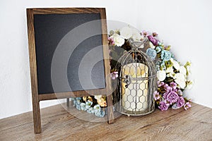 Blank Blackboard wooden easel with flower and LED candle light decoration