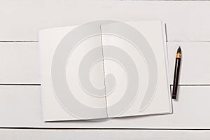 Blank book cover template with page in front side standing on white wood background