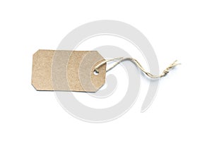 Blank brown cardboard price tag or label tag with thread isolated on white background
