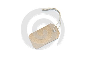 Blank brown cardboard price tag or label tag with thread isolated on white background